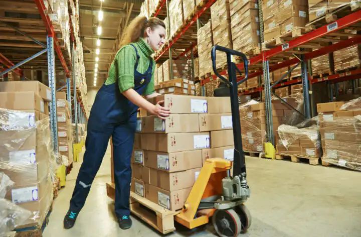 worker in warehouse with bar code scanner